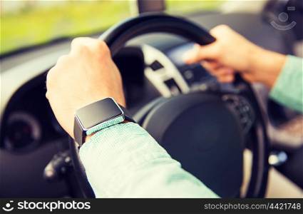 transport, business trip, technology, time and people concept - close up of man with wristwatch driving car