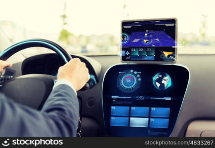 transport, destination, modern technology and people concept - close up of man driving car with navigation system on tablet pc computer