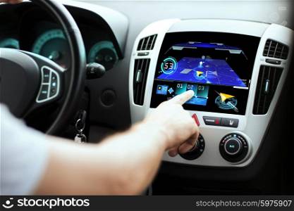 transport, destination, modern technology and people concept - male hand searching for route using navigation system on car dashboard screen