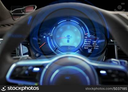 transport, drive and technology concept - close up of car dashboard with speedometer and tachometer. close up of car dashboard and steering wheel