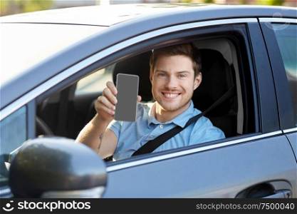 transport, driving and technology concept - man or car driver showing smartphone. man or car driver showing smartphone