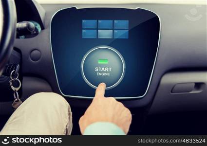 transport, driving, technology and people concept - close up of male hand using starter application on car computer