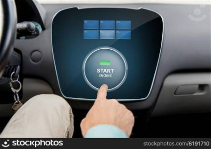 transport, driving, technology and people concept - close up of male hand using starter application on car computer