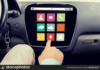 transport, driving, technology, media and people concept - close up of male hand with virtual applications icons on car computer screen