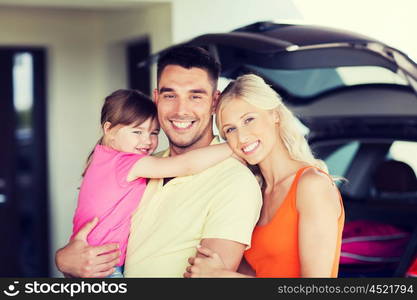 transport, leisure, road trip and people concept - happy family and little girl with hatchback car at home parking space