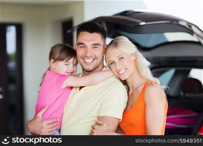 transport, leisure, road trip and people concept - happy family and little girl with hatchback car at home parking space