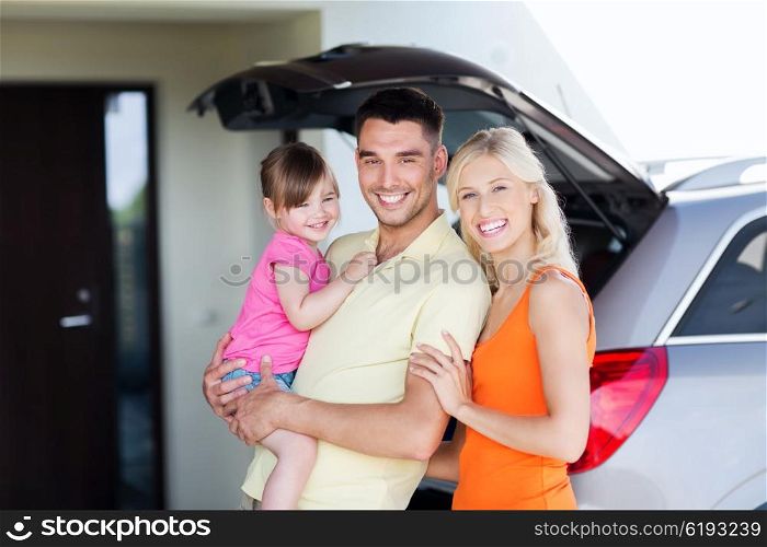 transport, leisure, road trip and people concept - happy family and little girl with hatchback car at home parking space