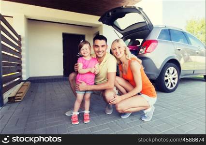 transport, leisure, road trip and people concept - happy family with little girl and hatchback car at home parking space