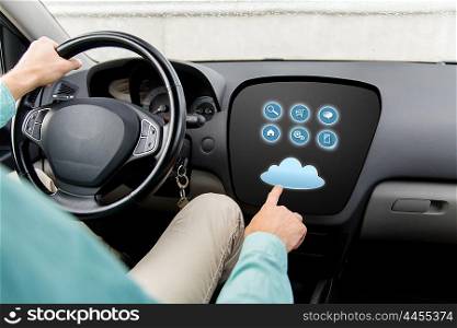 transport, modern technology and people concept - close up of man driving car with menu on board computer screen and cloud icon