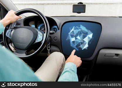 transport, modern technology and people concept - close up of man driving car and pointing finger to low poly shape on board computer screen