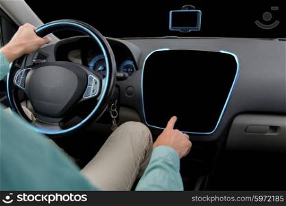 transport, modern technology and people concept - close up of man driving car and pointing finger to black blank on board computer screen