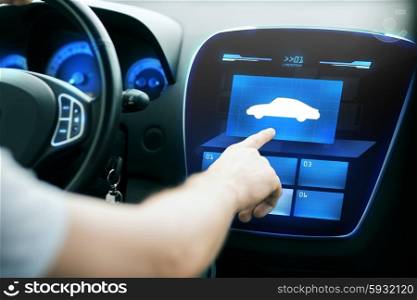 transport, modern technology and people concept - male hand pointing finger to car icon on control panel screen. male hand pointing finger to car icon on panel