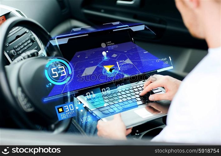 transport, modern technology and people concept - man using navigation system on laptop computer in car