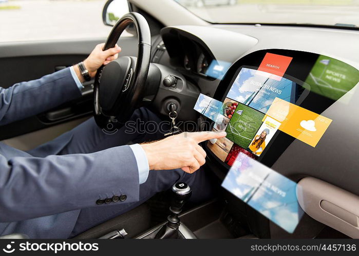 transport, modern technology, business, media and people concept - close up of man driving car with news on board computer screen