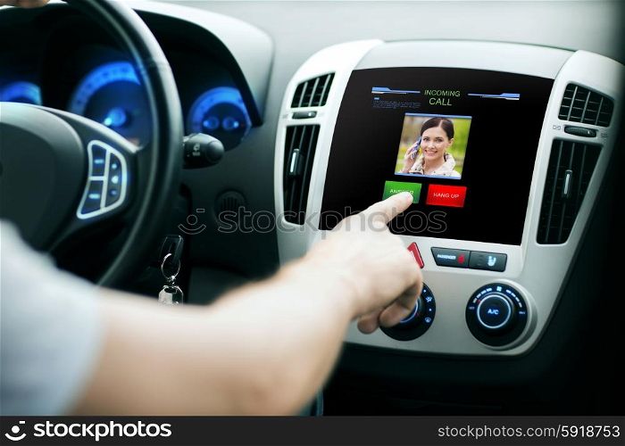 transport, modern technology, communication and people concept - male hand pushing button and receiving video call from woman on car panel screen
