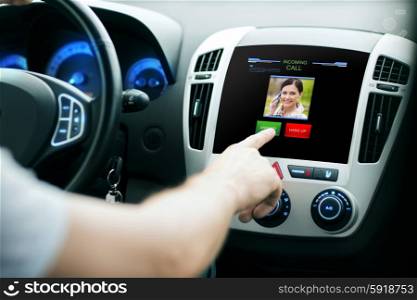 transport, modern technology, communication and people concept - male hand pushing button and receiving video call from woman on car panel screen