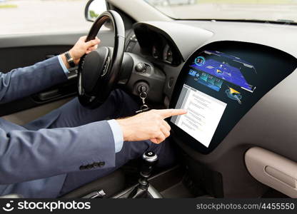 transport, navigation, business trip, modern technology and people concept - close up of man driving car with gps navigator and coding on board computer screen