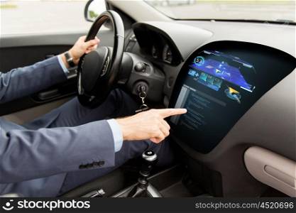 transport, navigation, business trip, modern technology and people concept - close up of man driving car with gps navigator on board computer screen