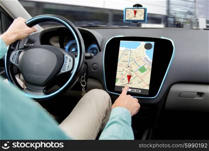 transport, road trip, car driving, technology and people concept - close up of male hand adjusting gps navigator while driving car