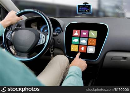 transport, road trip, car driving, technology and people concept - close up of male hand pointing to on-board computer menu