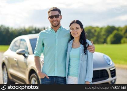 transport, road trip, travel, family and people concept - happy man and woman hugging at car
