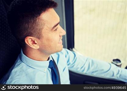 transport, tourism, business trip and people concept - close up of happy bus driver or businessman in shirt and tie. close up of happy bus driver or businessman