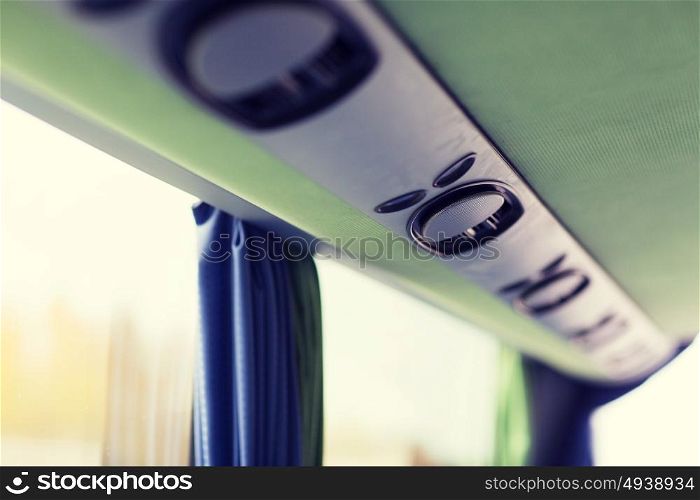 transport, tourism, road trip and equipment concept - close up of travel bus speakers. close up of travel bus speakers