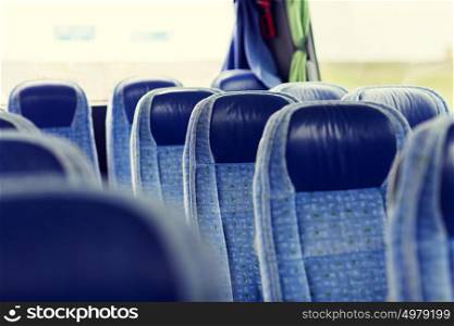 transport, tourism, road trip and equipment concept - travel bus interior and seats. travel bus interior and seats