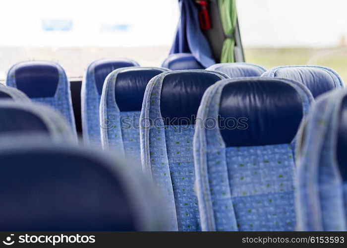 transport, tourism, road trip and equipment concept - travel bus interior and seats