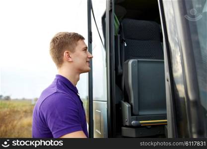 transport, tourism, road trip and people concept - group of happy male passenger boarding travel bus