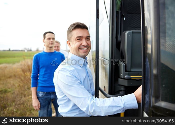 transport, tourism, road trip and people concept - group of happy male passengers boarding travel bus