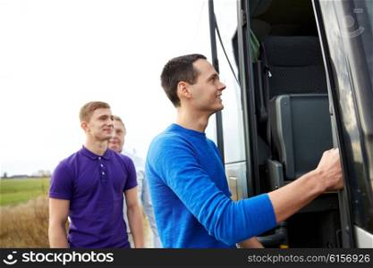 transport, tourism, road trip and people concept - group of happy male passengers boarding travel bus