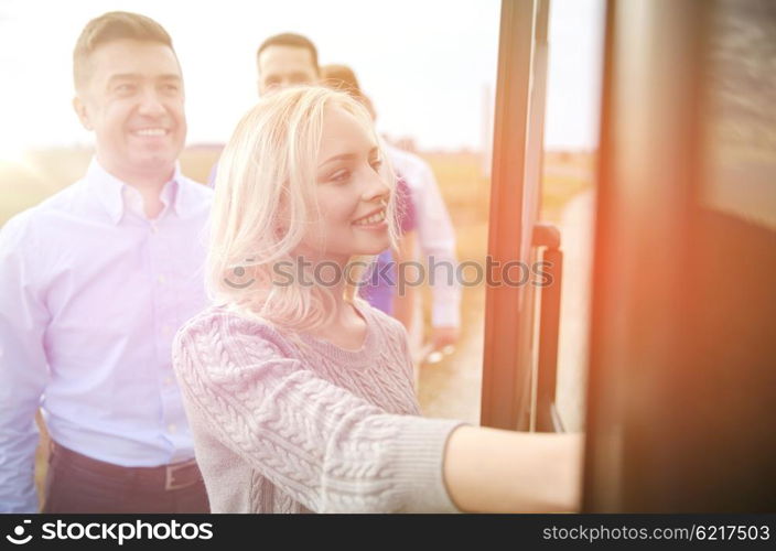 transport, tourism, road trip and people concept - group of happy passengers boarding travel bus