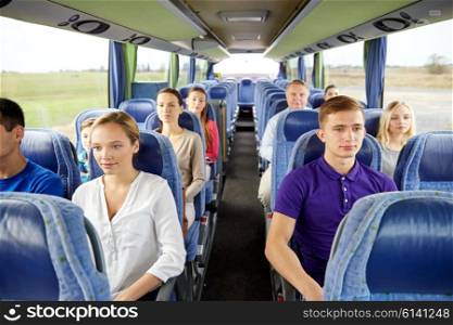transport, tourism, road trip and people concept - group of passengers or tourists in travel bus