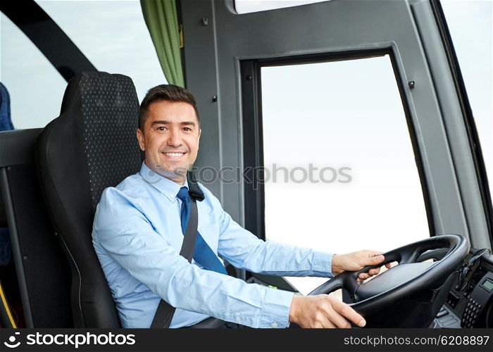 transport, tourism, road trip and people concept - happy driver driving intercity bus
