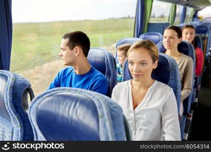 transport, tourism, road trip and people concept - woman with group of passengers or tourists in travel bus