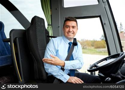 transport, tourism, road trip, gesture and people concept - happy driver inviting on board of intercity bus