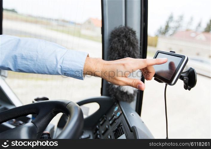 transport, transportation, tourism, navigation and people concept - close up of bus driver with gps navigator driving passenger bus