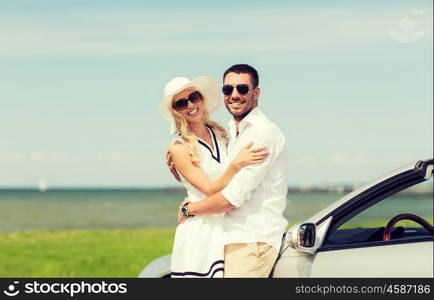 transport, travel, love, date and people concept - happy man and woman hugging near cabriolet car at sea side