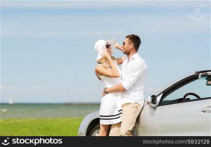 transport, travel, love, date and people concept - happy man and woman hugging near cabriolet car at sea side