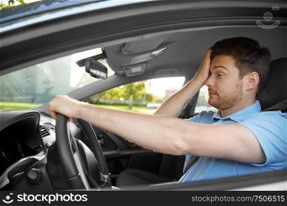 transport, vehicle and driving concept - tired sleepy man or car driver rubbing eyes. tired sleepy man or driver driving car