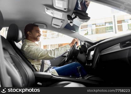 transport, vehicle and people concept - happy smiling indian man or driver driving car. smiling indian man or driver driving car