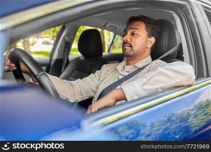 transport, vehicle and people concept - indian man or driver driving car. indian man or driver driving car