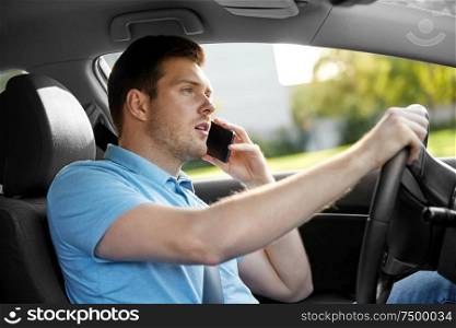transport, vehicle and people concept - man or driver driving car and calling on smartphone. man driving car and calling on smartphone