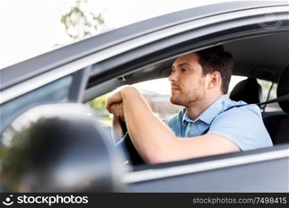 transport, vehicle and people concept - man or driver driving car in summer. man or driver driving car in summer