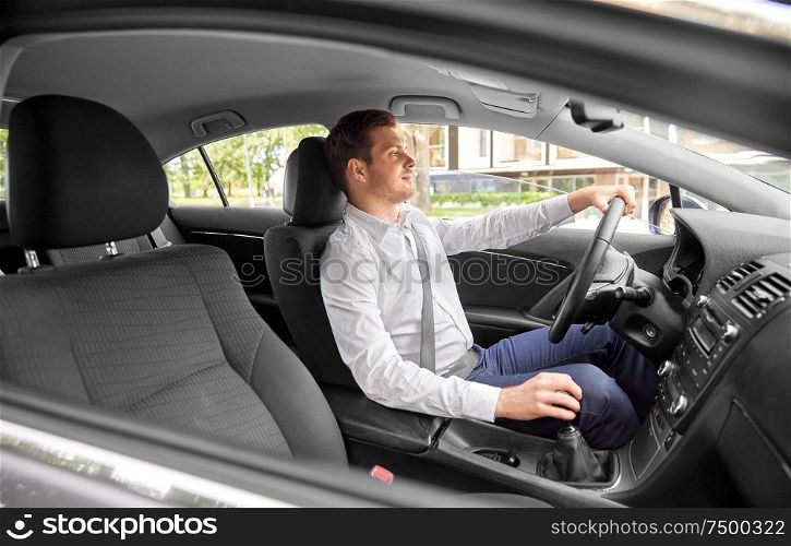 transport, vehicle and people concept - man or driver driving car in summer. man or driver driving car
