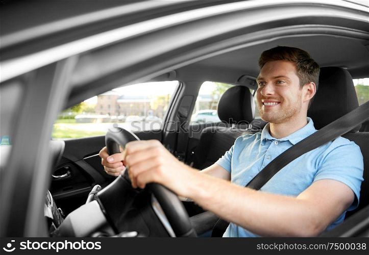 transport, vehicle and people concept - smiling man or driver driving car in summer. smiling man or driver driving car