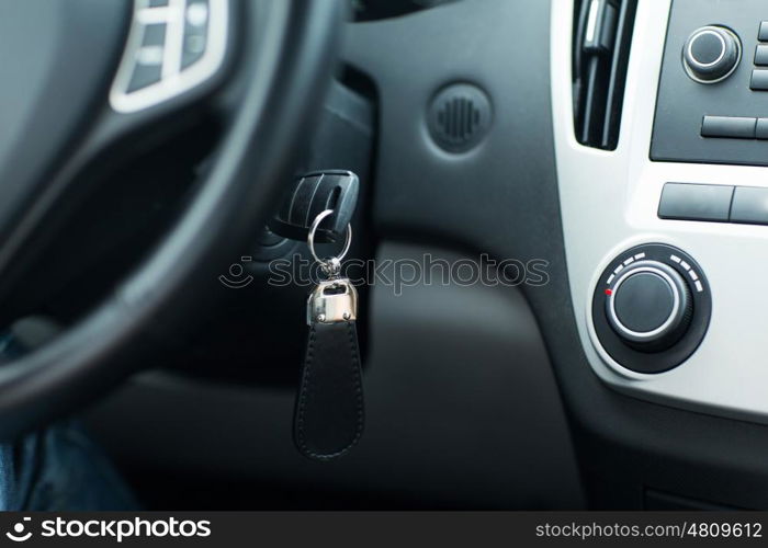 transportation and ownership concept - car key in ignition start lock. car key in ignition start lock