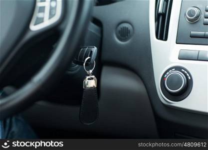 transportation and ownership concept - car key in ignition start lock. car key in ignition start lock