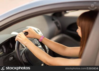 transportation and vehicle concept - happy woman driving a car